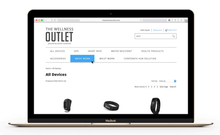 A laptop displays The Wellness Outlet store website, showcasing a selection of wrist-worn fitness trackers. The site features categories like "All Devices," "Wrist Worn," and "Health Products.