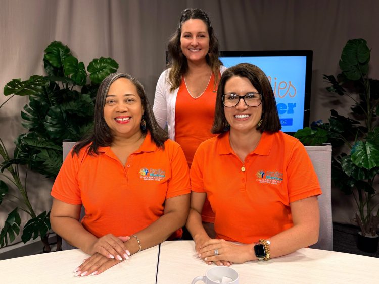 Three smiling women wearing matching shirts with "Families Matter" logo.