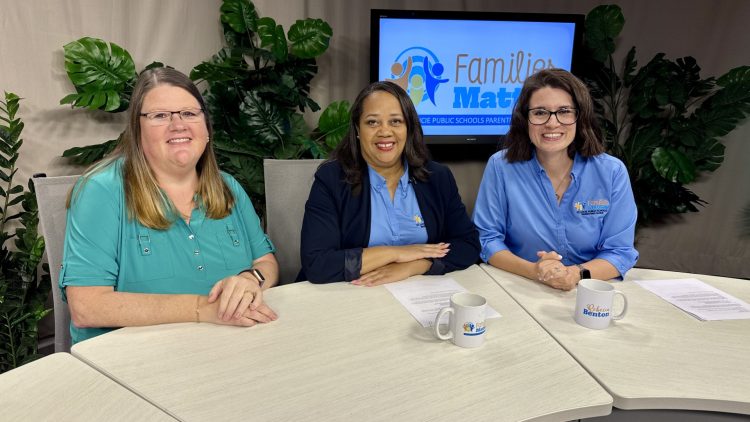 Three women from Families Matter sit at a table with mugs in a studio setting.