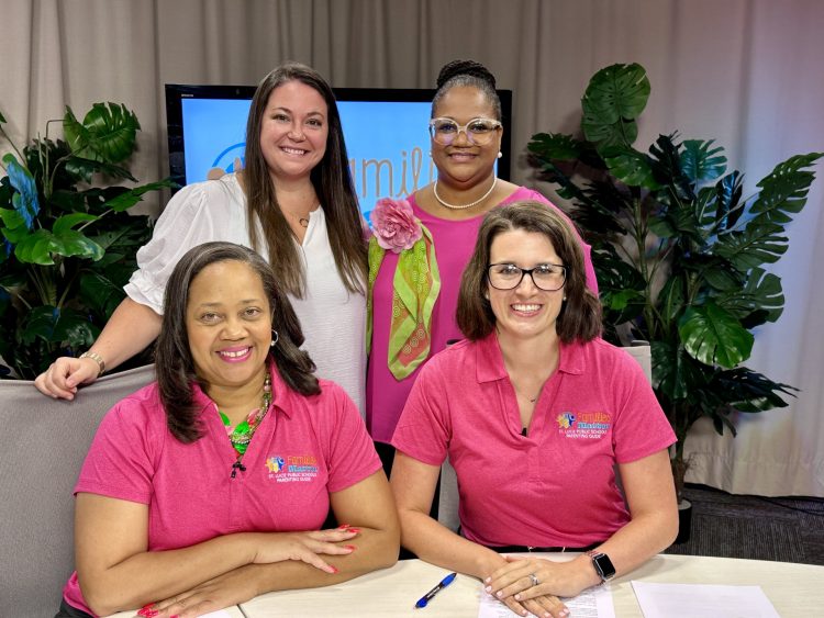 St Lucie Schools Parenting Guide Promo Four women promoting St. Lucie Public Schools Parenting Guide, wearing branded shirts.