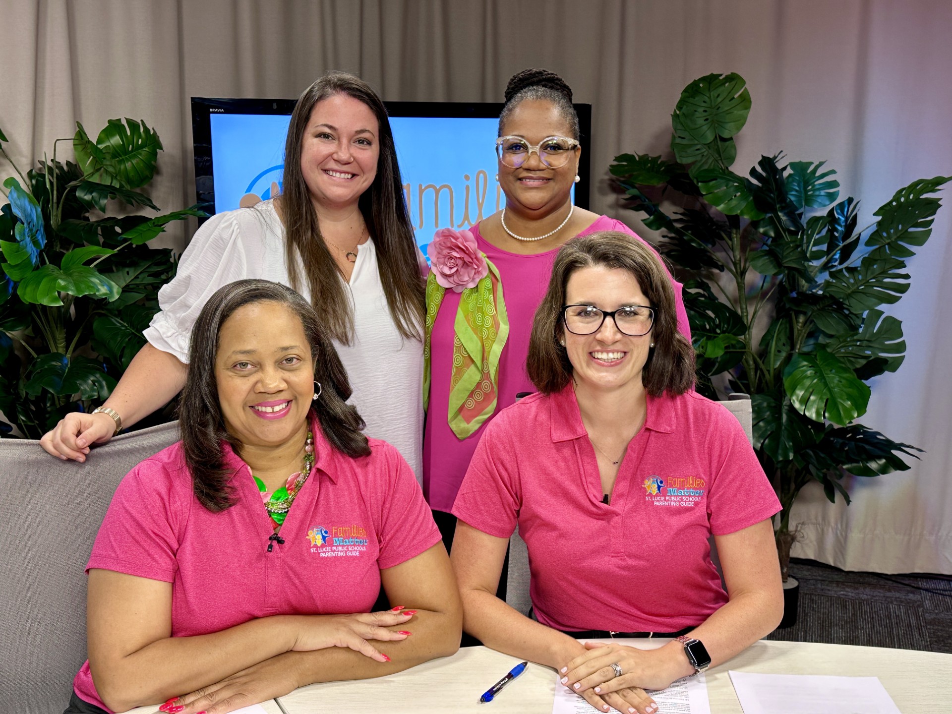 St Lucie Schools Parenting Guide Promo Four women promoting St. Lucie Public Schools Parenting Guide, wearing branded shirts.